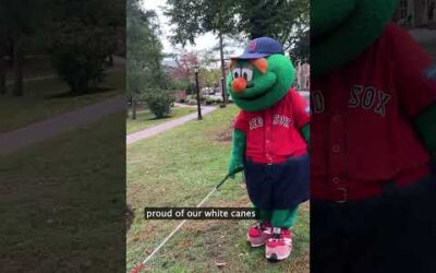 Wally the Green Monster uses a white cane